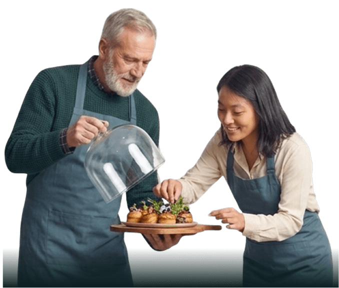 Restaurant employees preparing and serving food together.