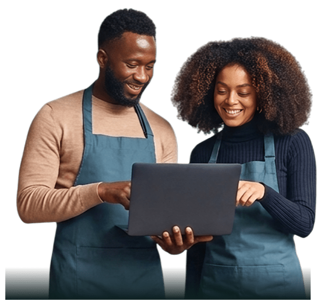 Restaurant employees reviewing laptop together.